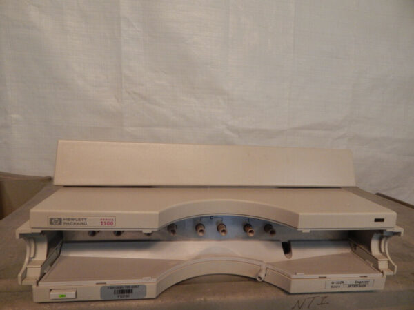 Opened beige Hewlett Packard inkjet printer.